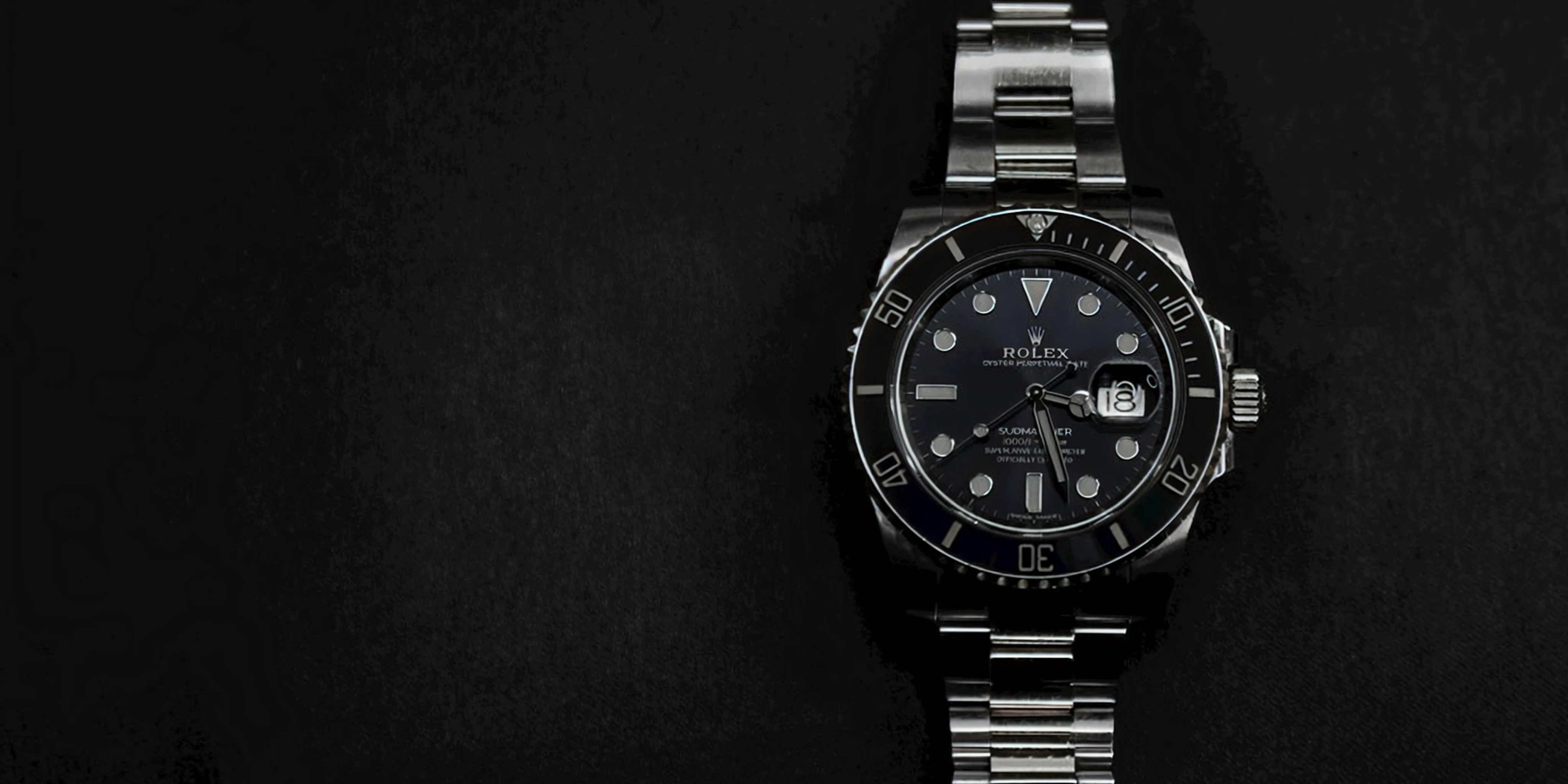 Silver watch with a black face