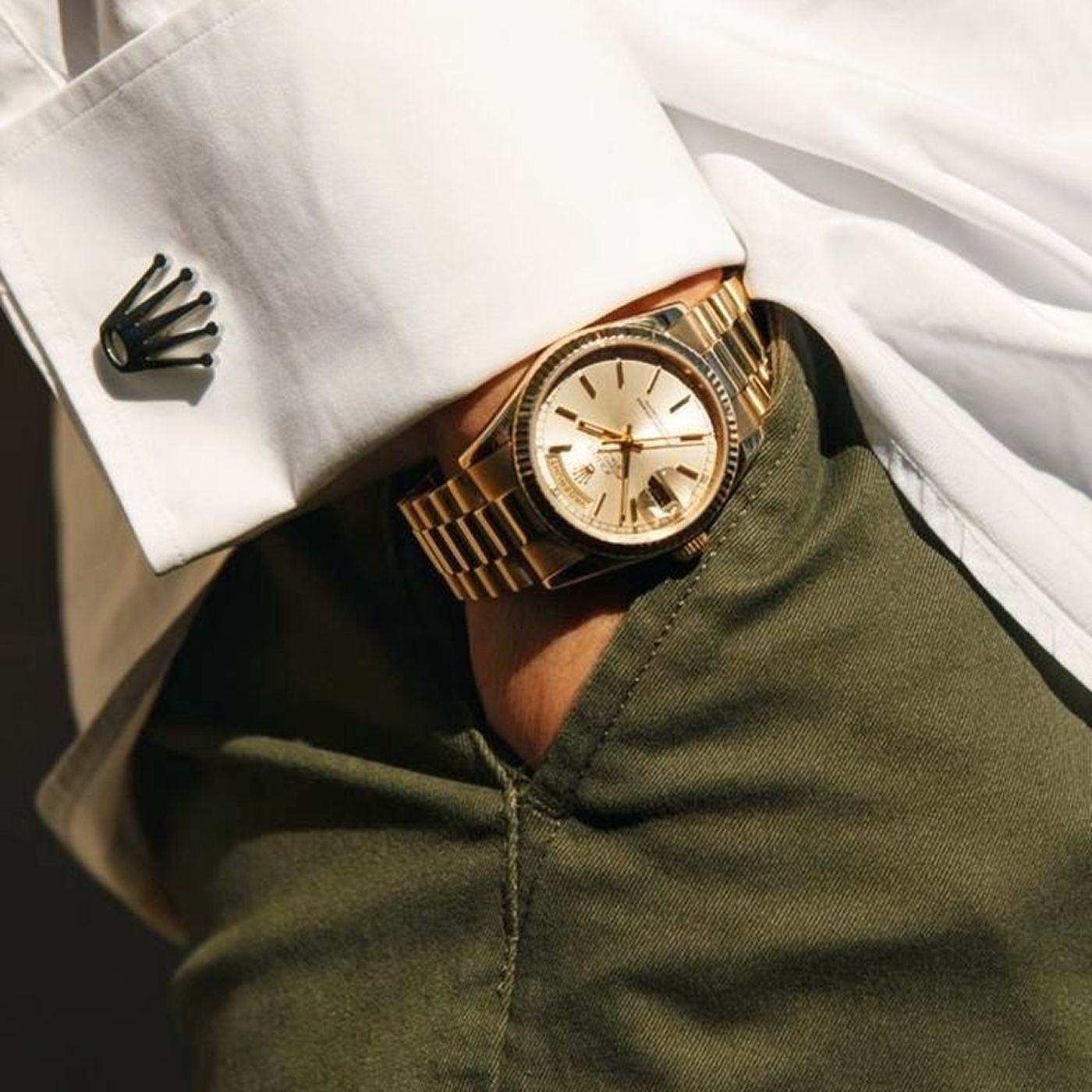 Gold Rolex on person
